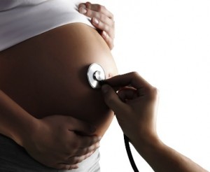 An isolated shot of a pregnant woman being examined by a doctor